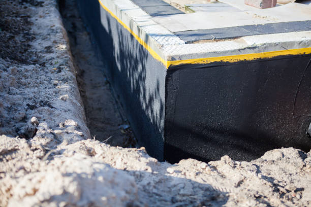 Professional Emergency Waterproofing technician working in Neenah, WI